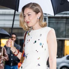 Gigi Hadid wearing a white mini dress in NYC