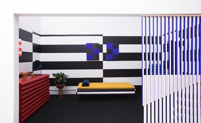 Conceptual hotel suite with black and white striped wall
