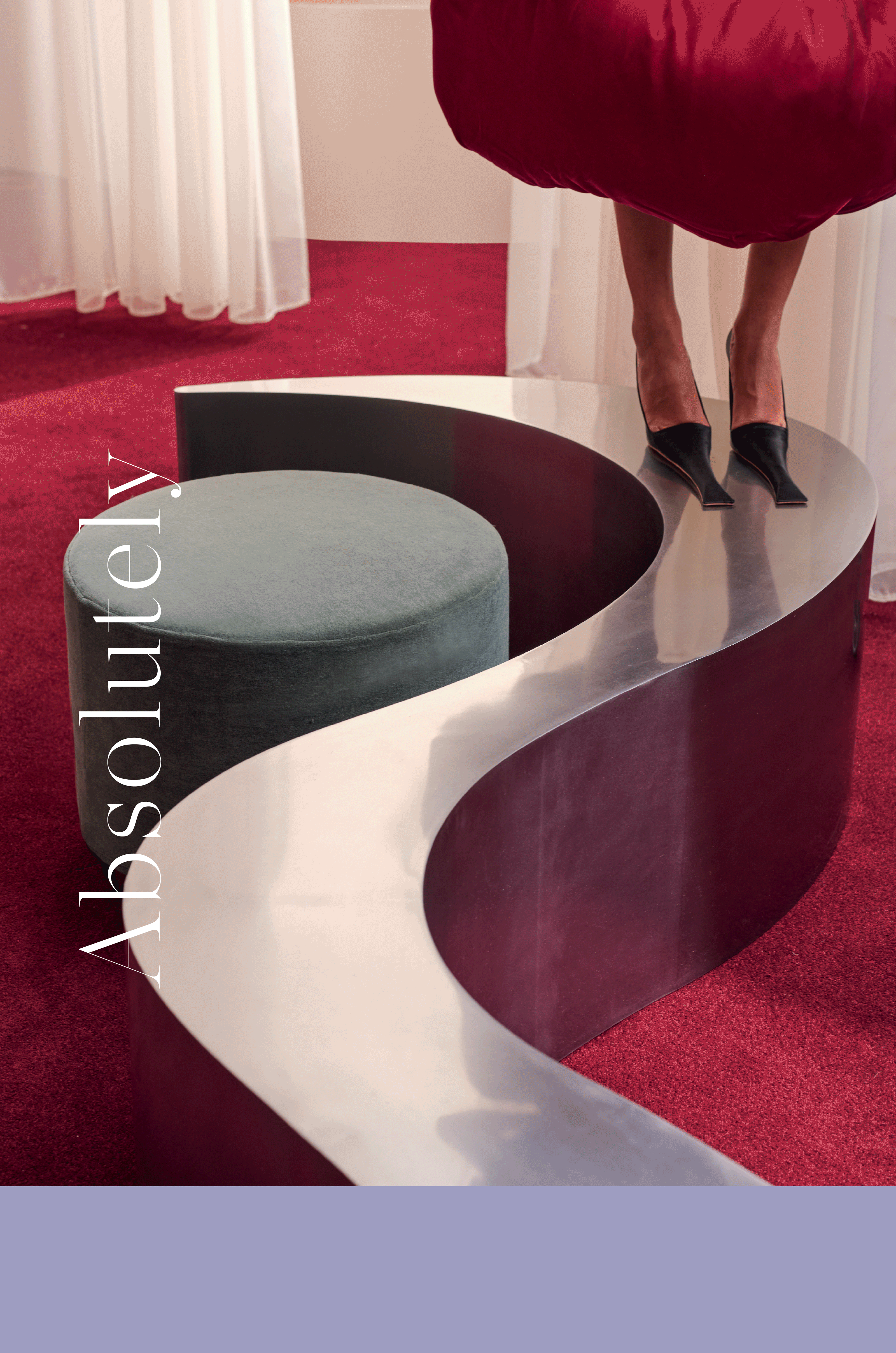 a woman with pointed shoes standing on a chrome curved coffee table 