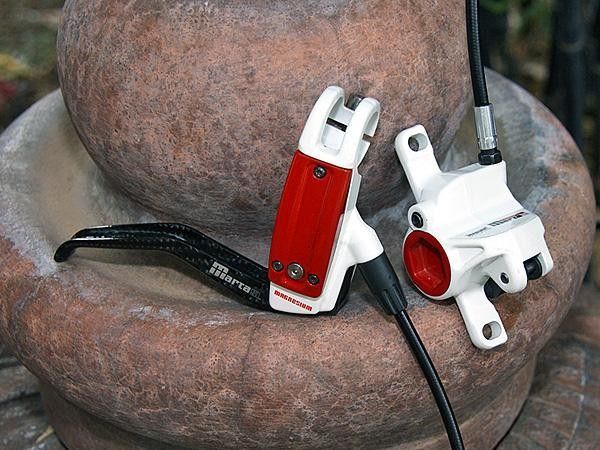 Magnesium lever bodies and calipers