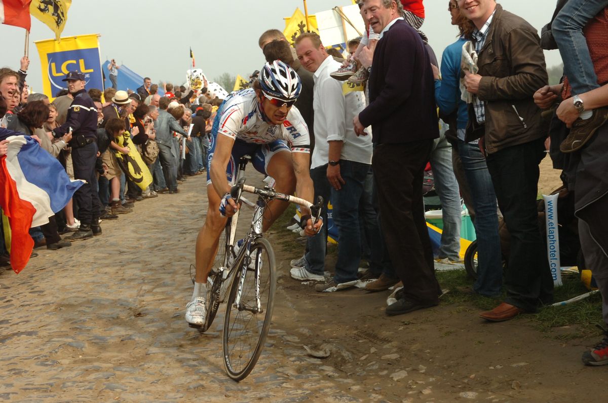 Filippo Pozzato chases Tom Boonen at Paris-Roubaix in 2009.