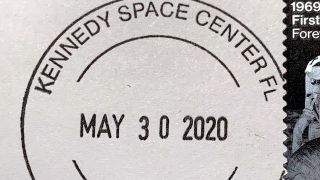 a stamp that reads "kennedy space center"