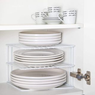 open shelve with white rack and teacups