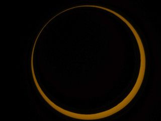 the moon blocks the sun in a ring of fire solar eclipse