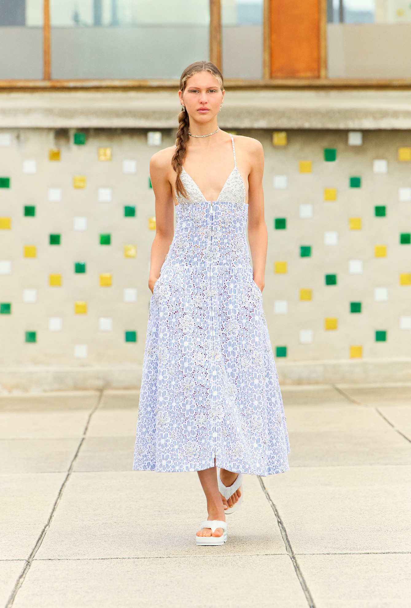 a model on the Cannes Resort runway wearing a Chanel floral dress