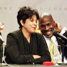 michael jordan of the chicago bulls r laughs as