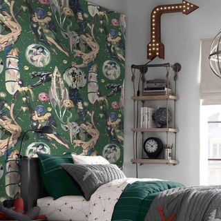 Sci-fi kids wallpaper with green and gray bedding and wall decor