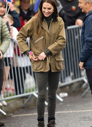 Kate Middleton wearing a Barbour jacket and jeans.