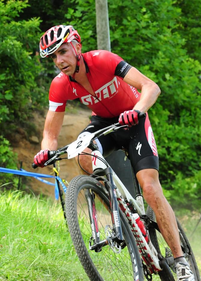 Todd Wells (Specialized) climbing at the end of lap four with Stephen Ettinger closing in.