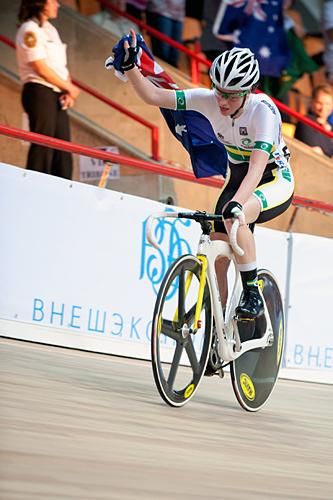 Australian rider Amy Cure celebrates after winning the scratch race.
