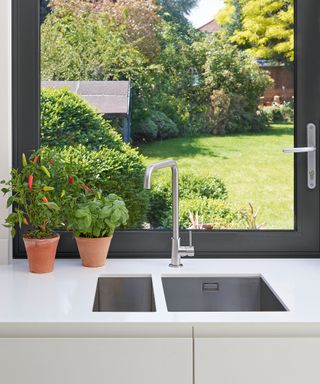 kitchen room sink potted plants glass window