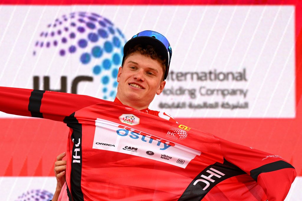 JEBEL HAFEET UNITED ARAB EMIRATES FEBRUARY 25 Lennert van Eetvelt of Belgium and Team Lotto Dstny celebrates at podium as final overall Red Leader Jersey winner during the 6th UAE Tour 2024 Stage 7 a 161km stage from Bait Mohammed Bin Khalifa Al Ain to Jebel Hafeet 1031m UCIWT on February 25 2024 in Jebel Hafeet United Arab Emirates Photo by Tim de WaeleGetty Images