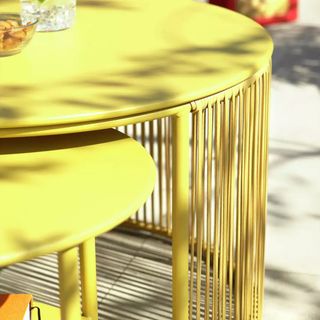 Close up of yellow Ipanema metal garden coffee table