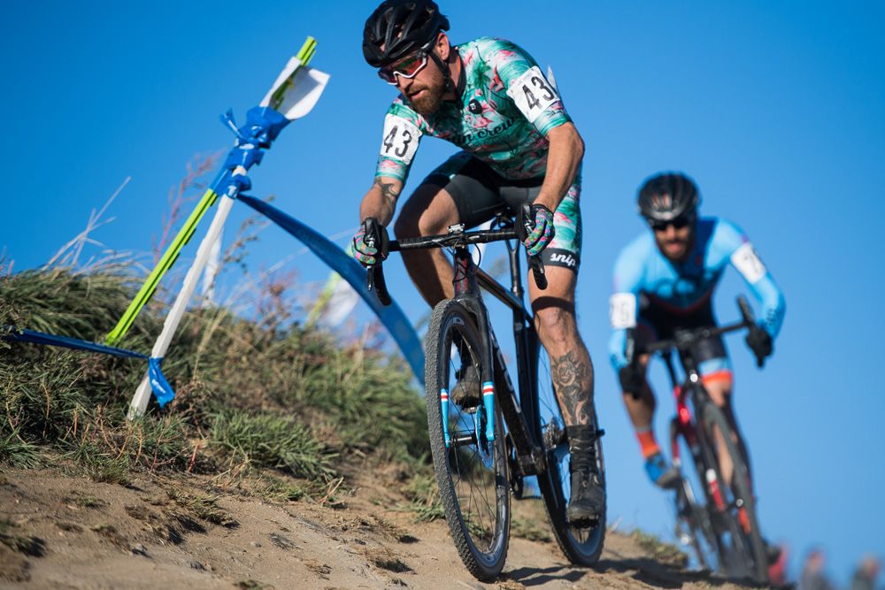 Riders negotiate an off camber descent