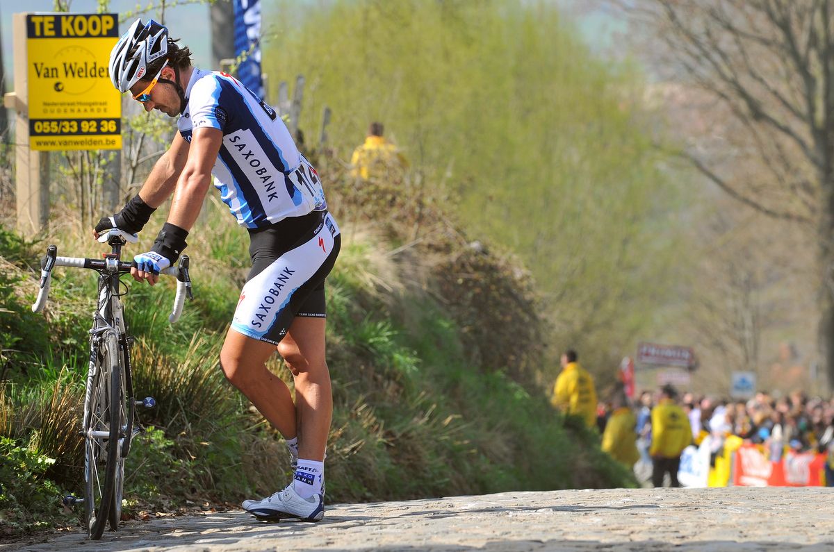 Fabian Cancellara waits for the team car at the top of the Koppenberg in 2009