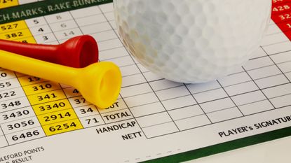How Many Golfers Break 100 image of a golf scorecard with tees and a golf ball