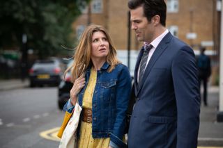 Sharon Horgan and Rob Delaney walking and talking on the set of Catastrophe