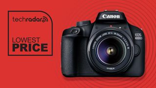 Canon EOS 4000D with 18-55mm lens attached on red background beside a lowest ever price text