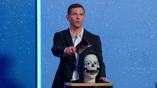 Mikey Day is poised to cut a cake in Is It Cake? season 2