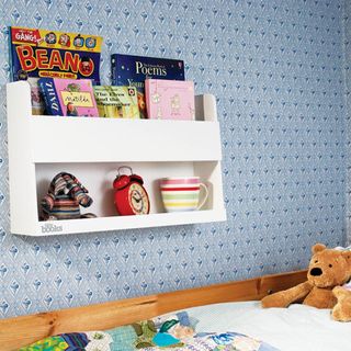 bedroom with bunk bed and bookshelves