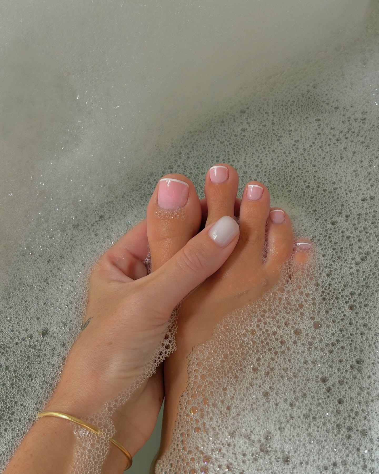 A jelly pink pedicure with a white French tip