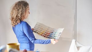 Woman looking at paint swatches