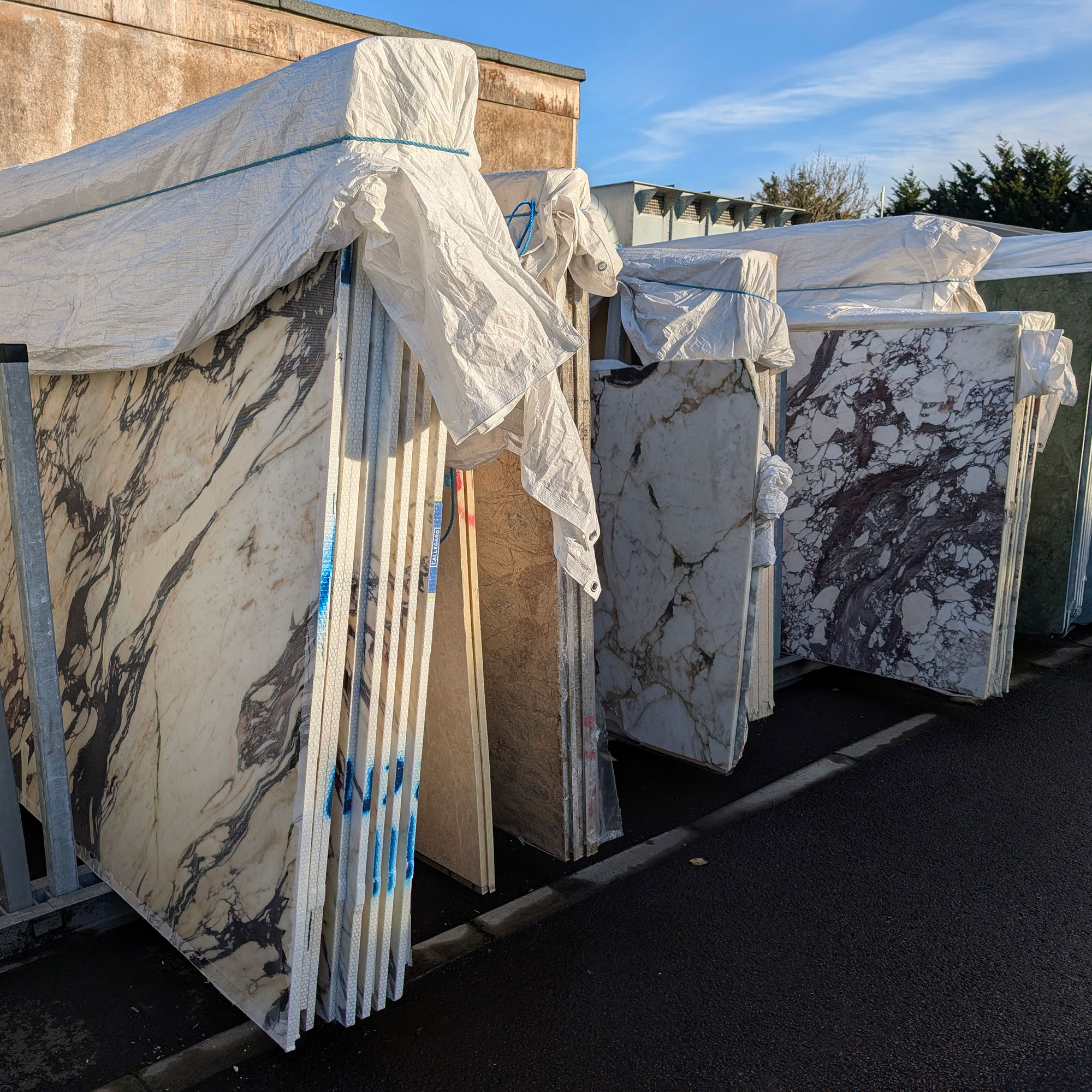 Large slabs of stone outside in warehouse yard