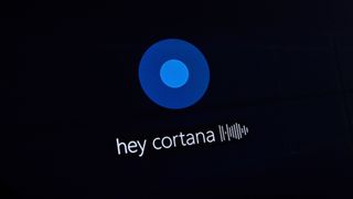 A screenshot displaying the words "Hey Cortana" on dark screen