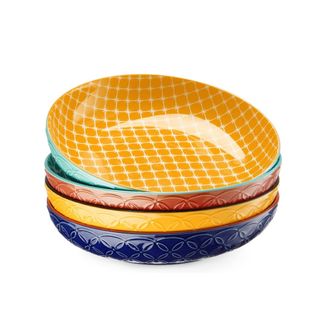 A stack of four colorful plate bowls