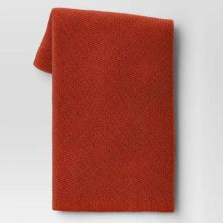 A burnt orange knit throw blanket is a cozy Target fall decor item.