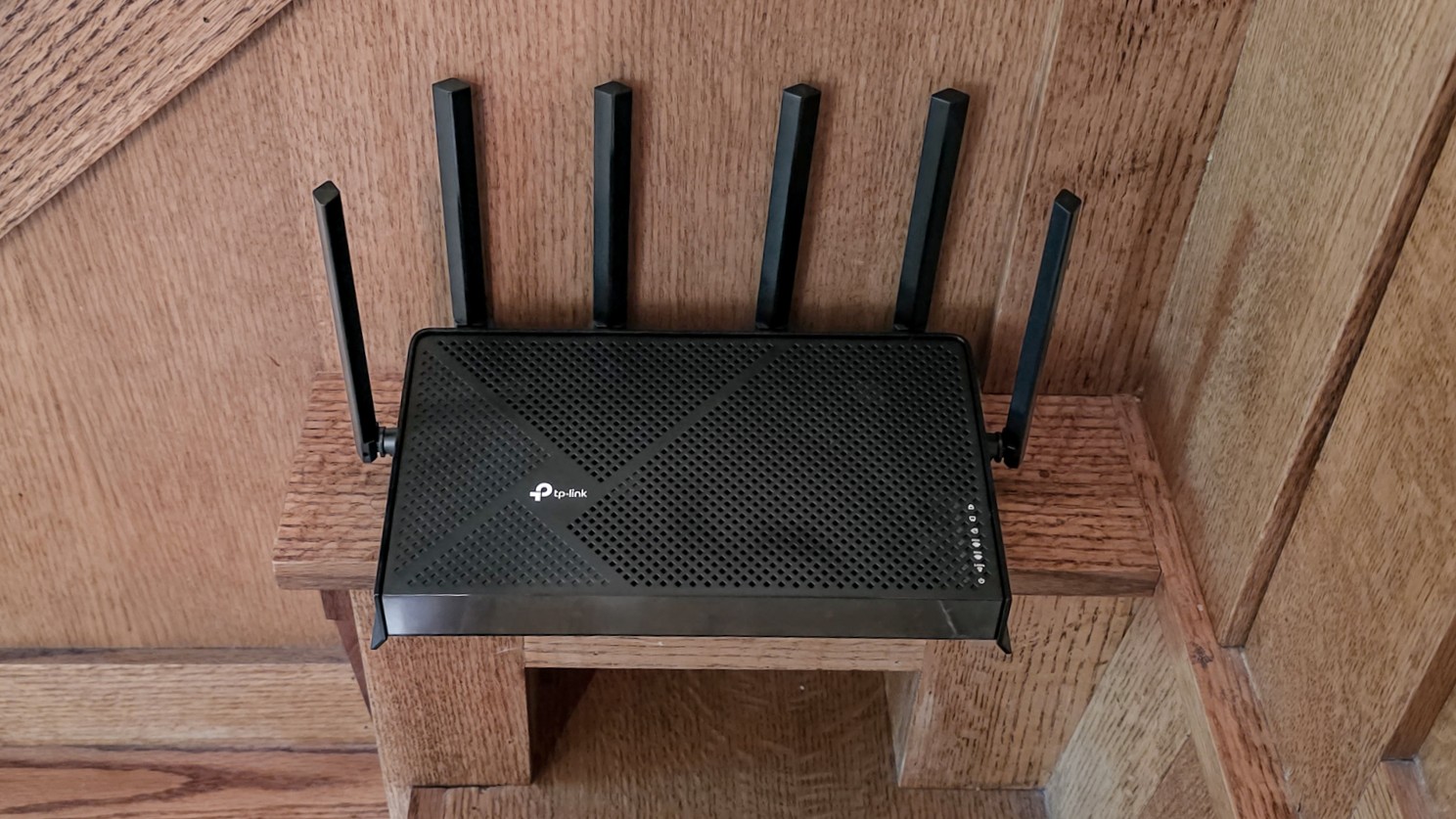 TP-Link Archer BE9700 router on a shelf
