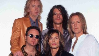 Aerosmith posing for a photograph in 1997