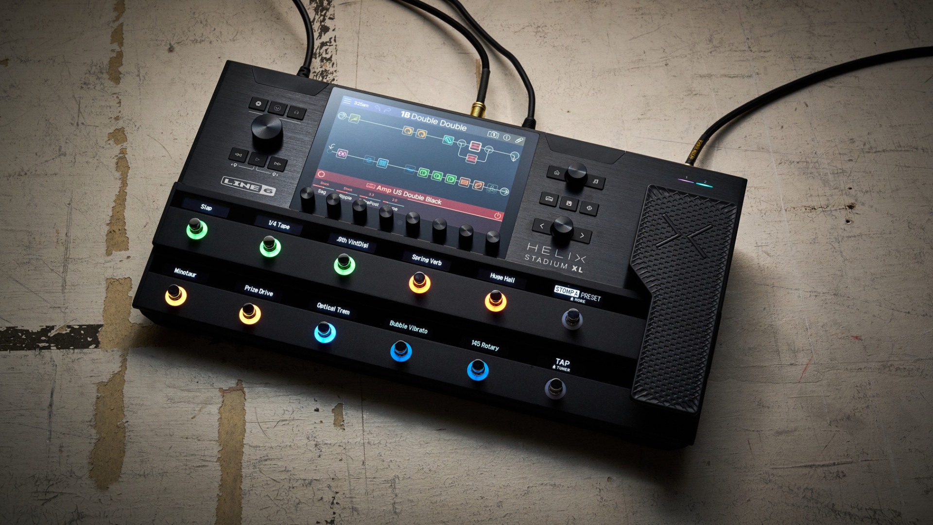 A Line 6 Helix Stadium XL multi-effects pedal on a concrete floor