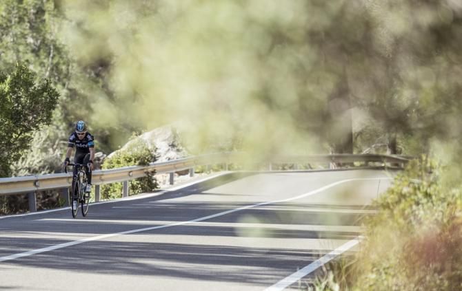 A lone Team Sky rider makes his way up a climb