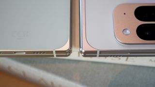 Comparing the Google Pixel 9 Pro Fold (white) with the Google Pixel 10 Pro Fold (green)