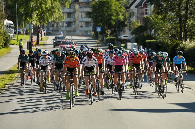 The peloton lined across the road