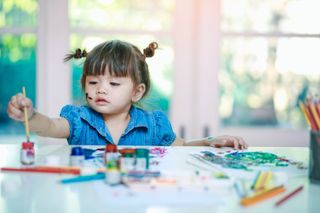 little girl painting