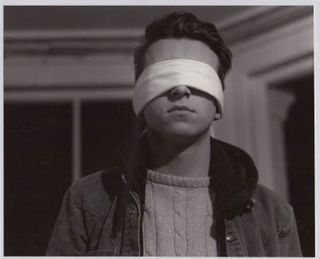 A blind folded man