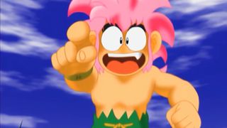 The protagonist of Tomba! points off into the distance with a big smile on his face.