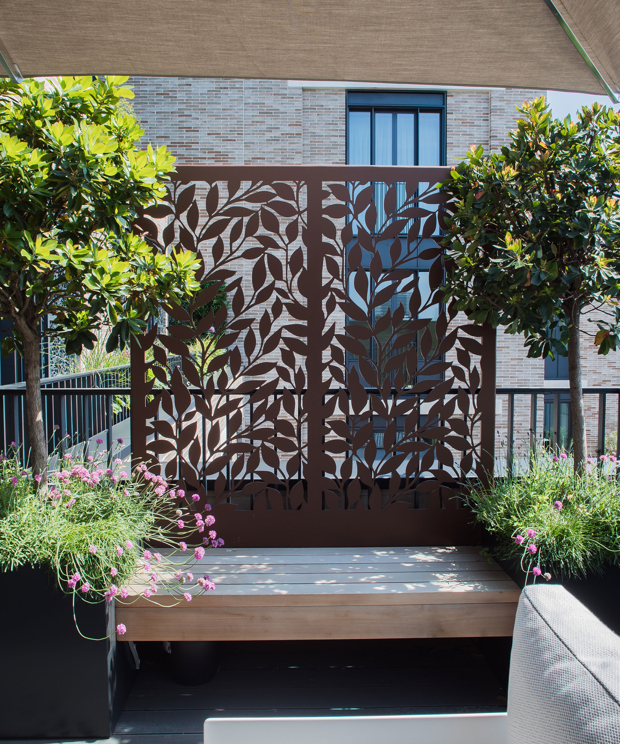 an outdoor space with a privacy screen