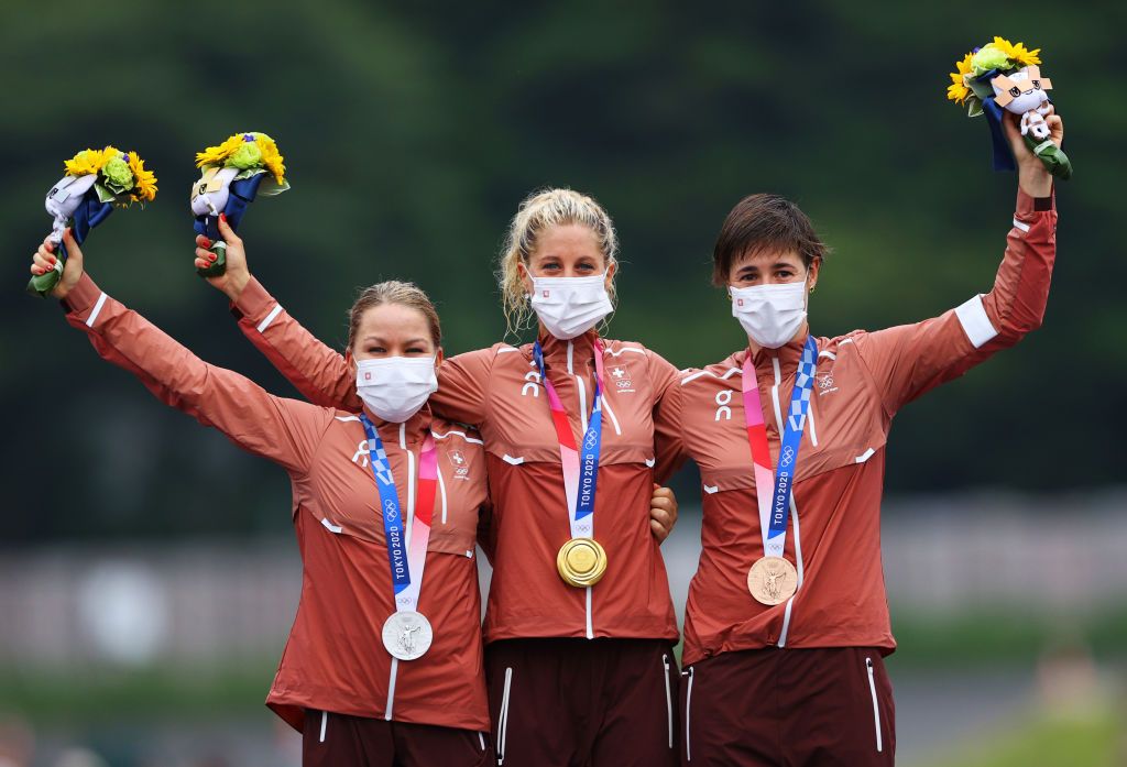 IZU JAPAN JULY 27 LR Silver medalist Sina Frei gold medalist Jolanda Neff and bronze medalist Linda Indergand of Team Switzerland pose on the podium during the medal ceremony during the Womens Crosscountry race on day four of the Tokyo 2020 Olympic Games at Izu Mountain Bike Course on July 27 2021 in Izu Shizuoka Japan Photo by Tim de WaeleGetty Images