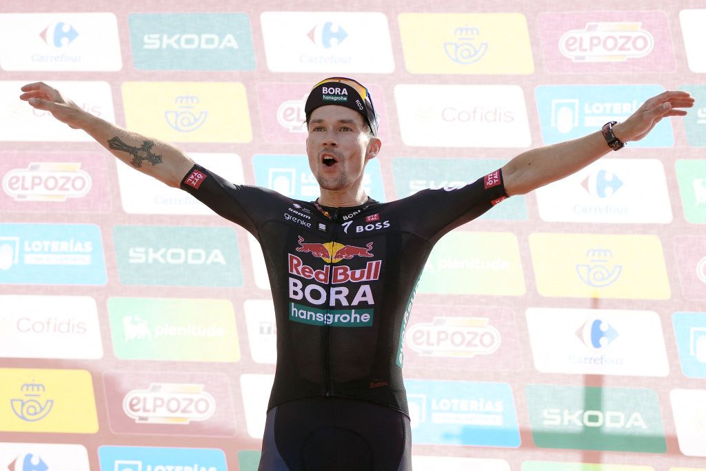 Team Bora's Primoz Roglic celebrates on the podium winning the stage 8 of La Vuelta a Espana cylcing tour, a 159 km race between Ubeda and Cazorla, on August 24, 2024. (Photo by Jorge GUERRERO / AFP)