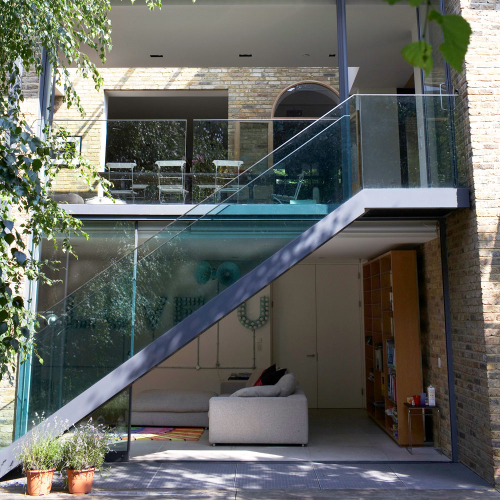 Glass extension with extension with terrace, staircase and a room for lounging
