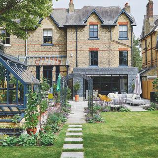 Garden patio leading to extended home