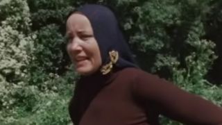 "Little" Edie Beale with her signature headscarf in Grey Gardens