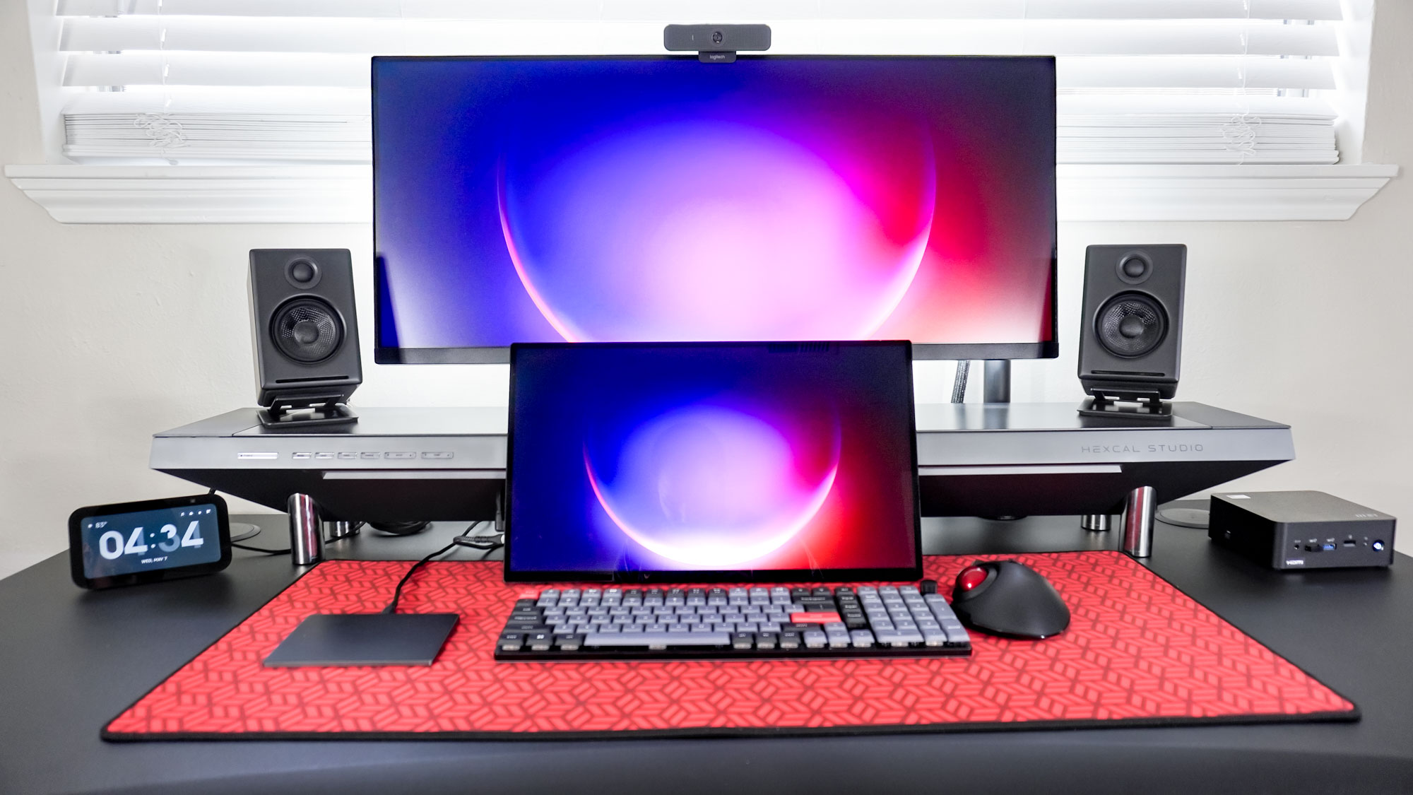 The MSI Cubi NUC 1M on the side of a dual-monitor desk setup