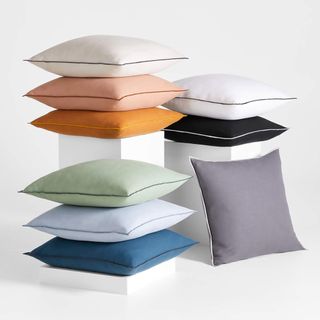 Square throw pillows in a variety of colors. 