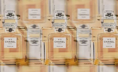 Chanel no.5 perfume bottles layered on top of one another 