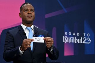 UEFA Champions League final ambassador Dutch former footballer Patrick Kluivert shows the paper slip of SSC Napoli (ITA) during the draw for the quarter-final, semi-final and final of the 2022-2023 UEFA Champions League football tournament, in Nyon, on March 17, 2023.