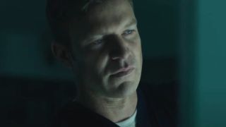 Matt Passmore looks pensively at an x-ray in Jigsaw.